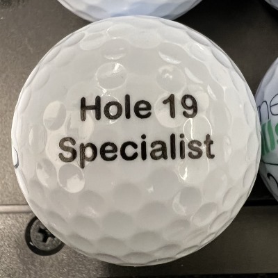 joke golf ball reading 'Hole 19 Specialist!'