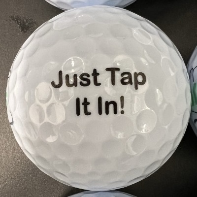 joke golf ball reading 'Just tap it in!'