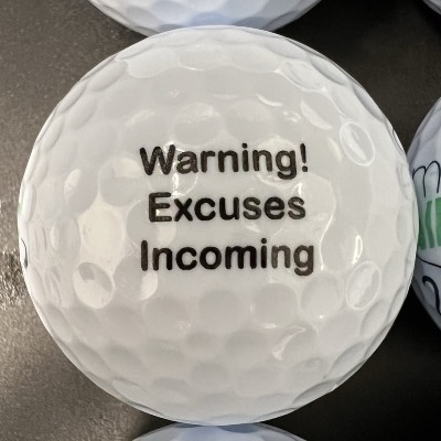 joke golf ball reading 'Warning! Excuses incoming'