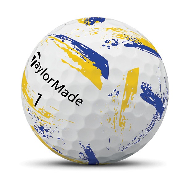 Golf ball with yellow and blue paint splatter design