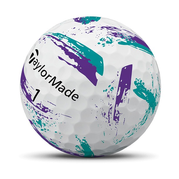 Golf ball with teal and purple paint splatter design
