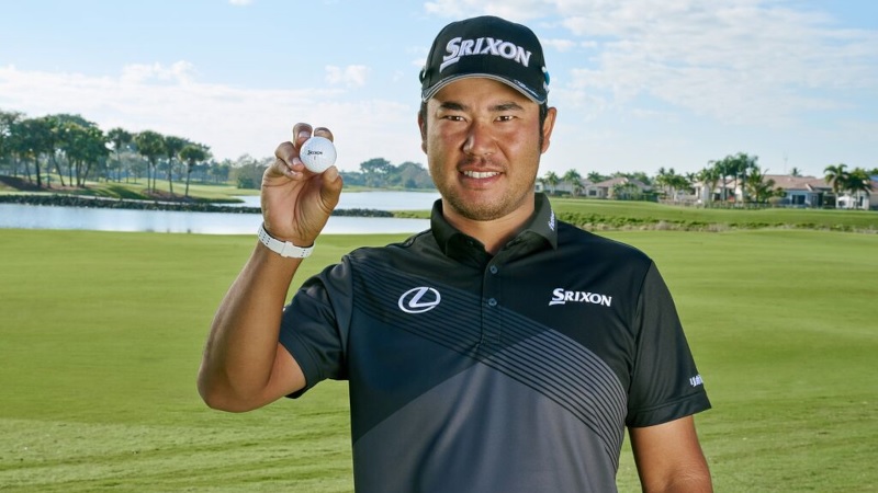 Hideki Matsuyama holding a Srixon Z-Star XV golf ball