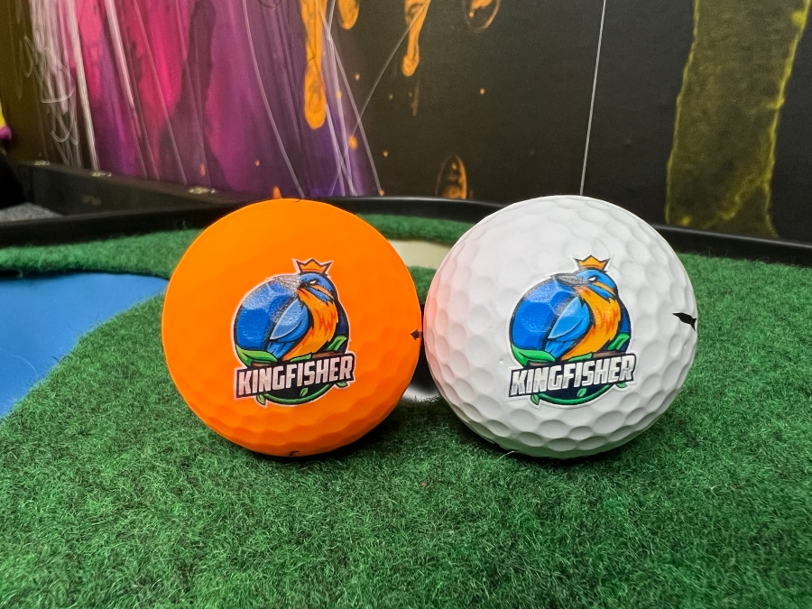 Orange and white golf balls